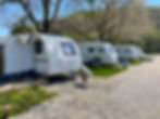 travel-trailer-with-open-tent-parked-caravan-campsite-riva-istanbul-turkey-april-04-2022.j