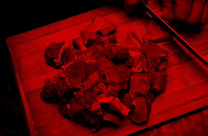 Cutting meat on a wooden chop board_edited_edited.jpg