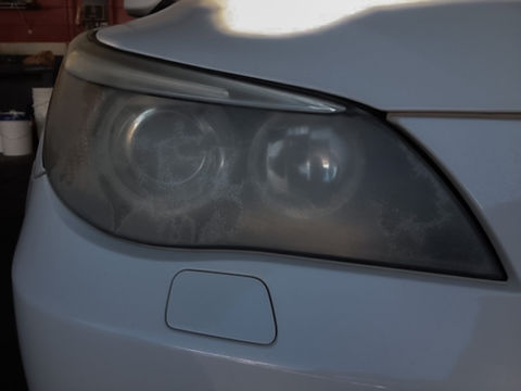 Engine bay cleaning with visible shine and grime removal