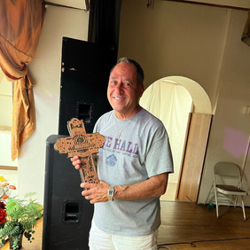 Siouxland Catholic Radio Board member, Dave Ferris, was presented with a handcrafted cross for his servant leadership.