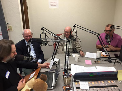 Founders talk with Fr. Mark Stoll during pledge drive.
