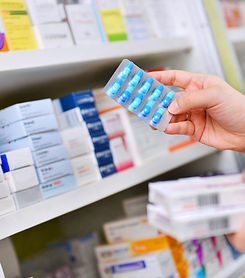 pharmacist-holding-medicine-box-capsule-pack-pharmacy-drugstore_edited.jpg
