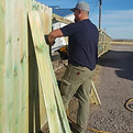 Tyler Hanging Fence.JPG