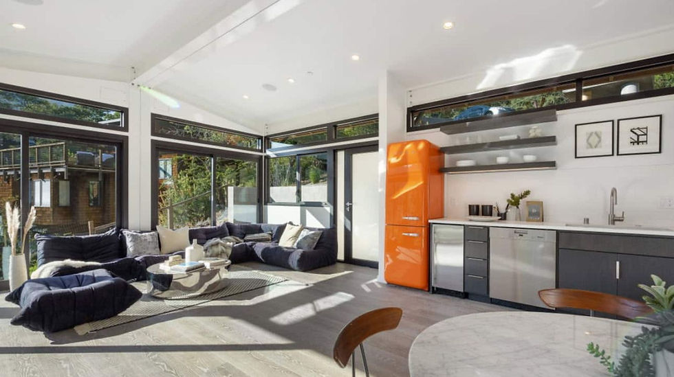 Humble Creek Construction custom dark lower cabinets white quartz counters and open floating shelves in modular home
