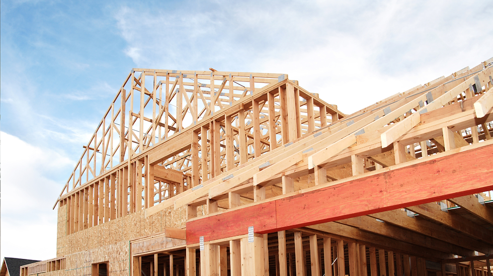 Timber frame construction process highlighting engineered wood beams and structural joinery for custom home build