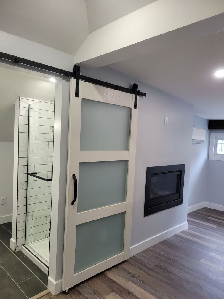 Attic conversion transforming unused space into a finished living area.