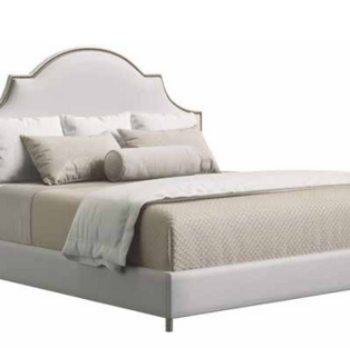 Upholstered bed with arched headboard