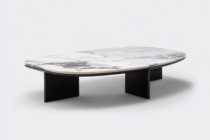 Organic shaped coffee table with smooth black oak base and white cobra marble top