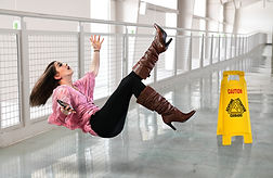 Young businesswoman falling on floor ins