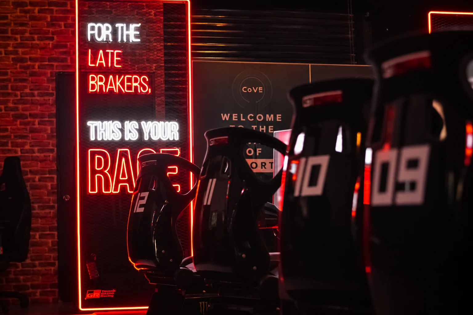 Real Cove Circuit venue seating and neon signage