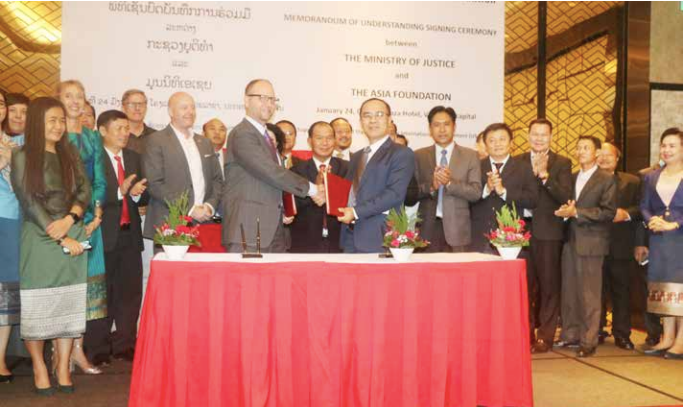 Mr Ketsana Phommachanh (right) shakes hands with Mr Todd Wassel after signing the Memorandum of Understanding on Friday