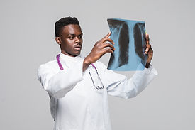 afro-american-young-medic-doctor-looking-x-ray-isolated-gray-background.jpg