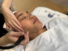 woman doing facial cupping tcm therapy