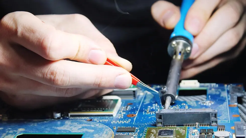 A2 ZEMS Electrician soldering components on a PCB