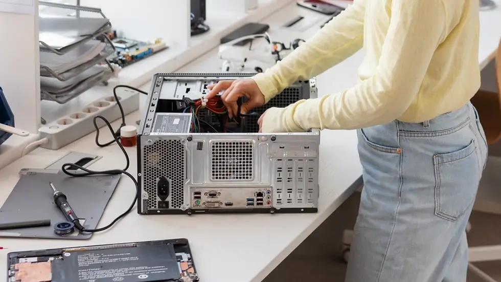 Technician assembling box build unit