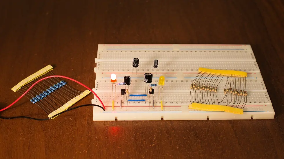 Breadboard circuit with capacitors, resistors & LEDs