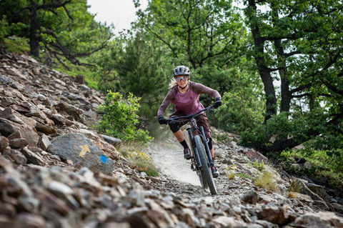 Woman riding an ebike in the forest