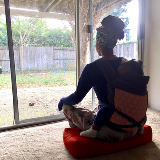 Kavisa Nourishing Justly - Meditating while her toddler sleeps in a baby carrier