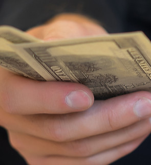 portrait-businessman-holding-money-counting-it_edited_edited_edited.jpg
