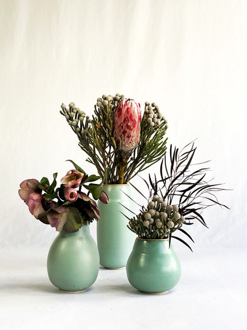 Handmade sculptural flower vases. Turquoise, mid-century modern style.