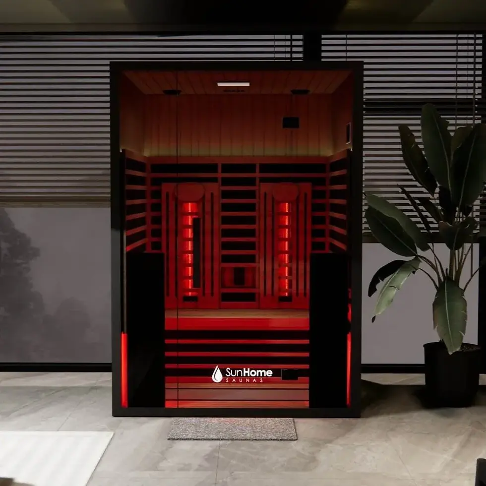 Sun Home Eclipse 2 infrared sauna interior showing dual red light therapy towers glowing in Canadian red cedar cabin