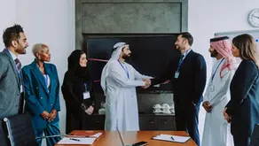 Business professionals discussing recruitment services and hiring strategy in Qatar