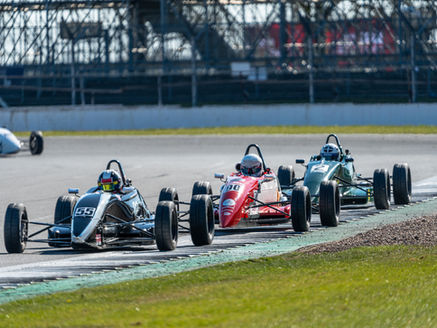 Spencer Shinner battling for position in Formula Ford race at Silverstone GP, 2025.