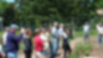 Parishioners look on at Garden Blessing May 21