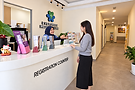 Friendly front-desk staff welcoming a visitor at Evergreen Medical Clinic’s reception in SS19, Petaling Jaya.