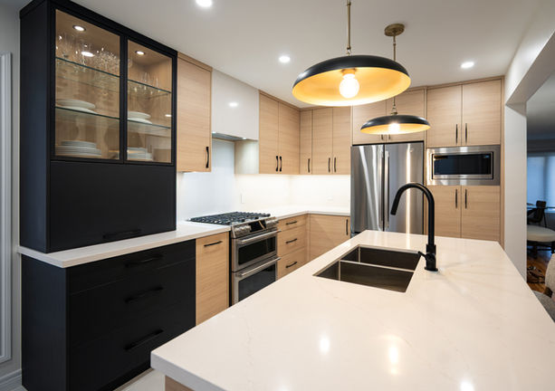 A full kitchen transformation in Courtice involving structural wall removal, engineered beam installation, and full permit approvals. Features custom two-tone cabinetry, a matte-black display hutch, upgraded lighting, and premium quartz countertops. Built with precision from demolition to final finishes.