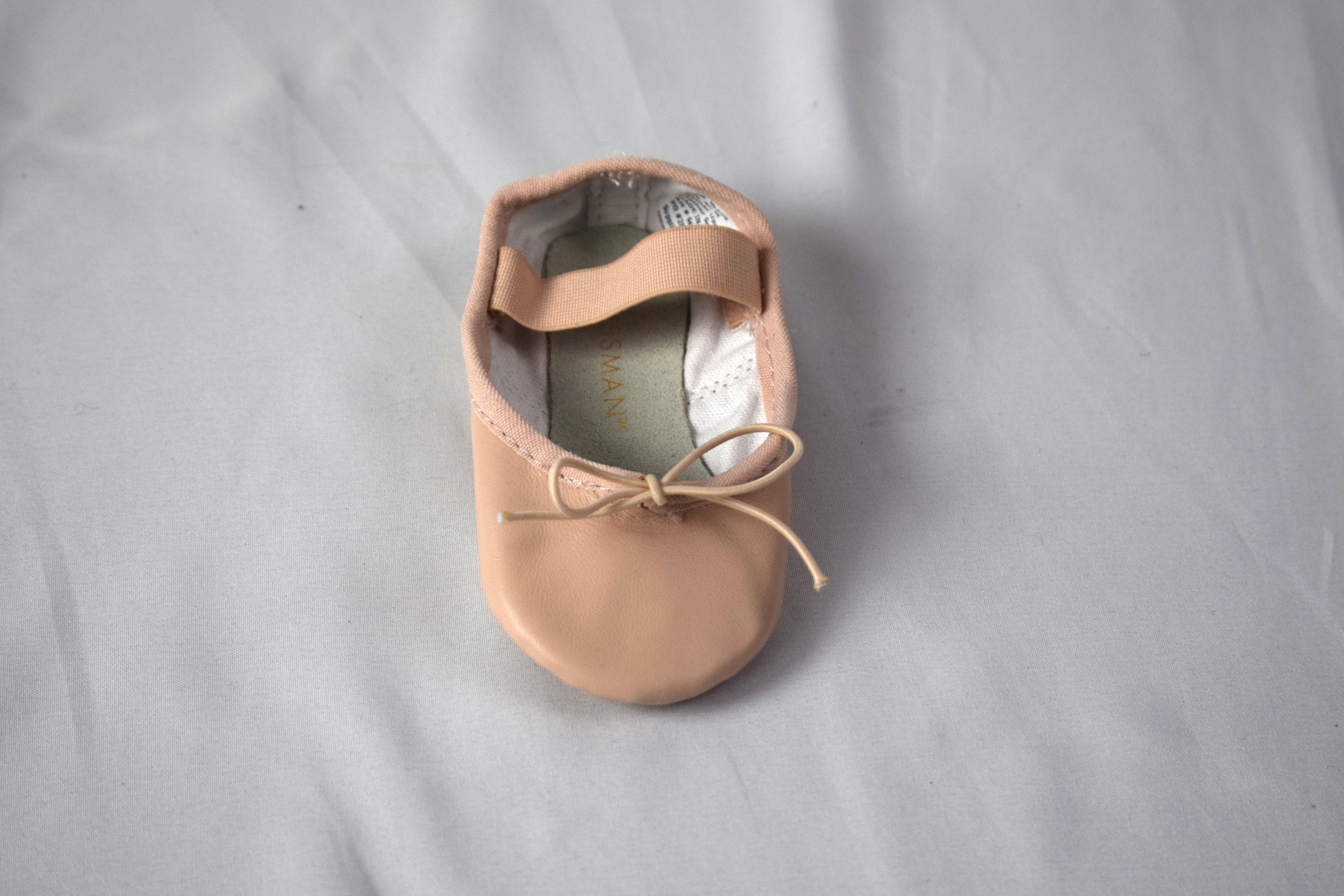front of pink ballet shoe.