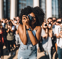black woman taking video of event.jpg