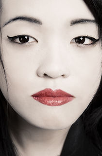 Young Asian Woman face with flags for eyes