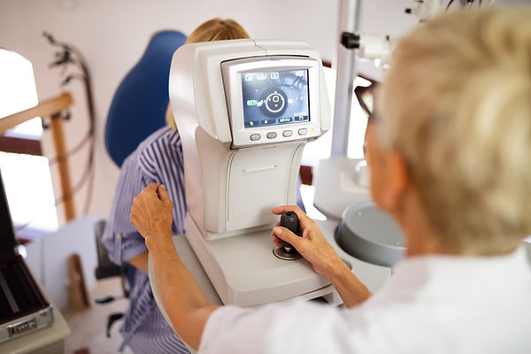 optometrist-examining-patient-in-modern-ophthalmol-2021-08-27-09-59-14-utc.jpg