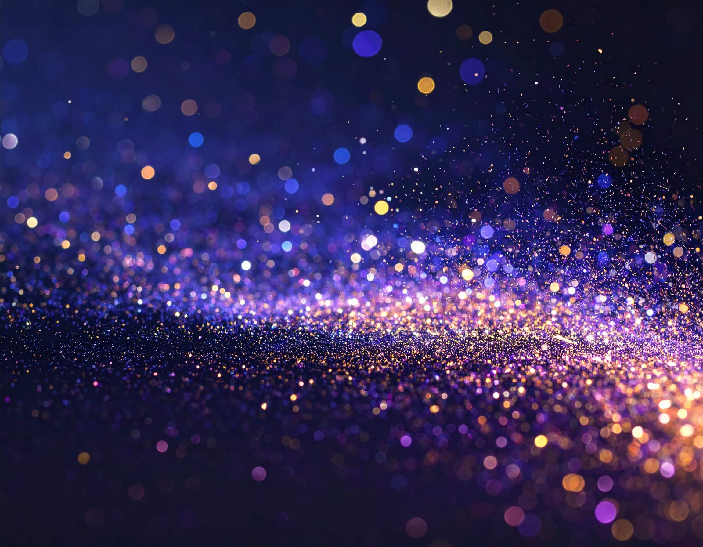  Floating luminous particles in gentle motion against deep space