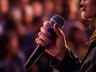 woman-speaking-into-microphone.jpg