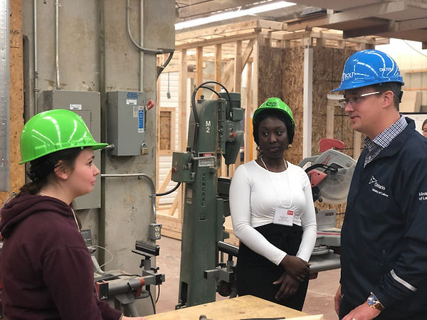 A particpant in our workforce development initiative learning carpentry