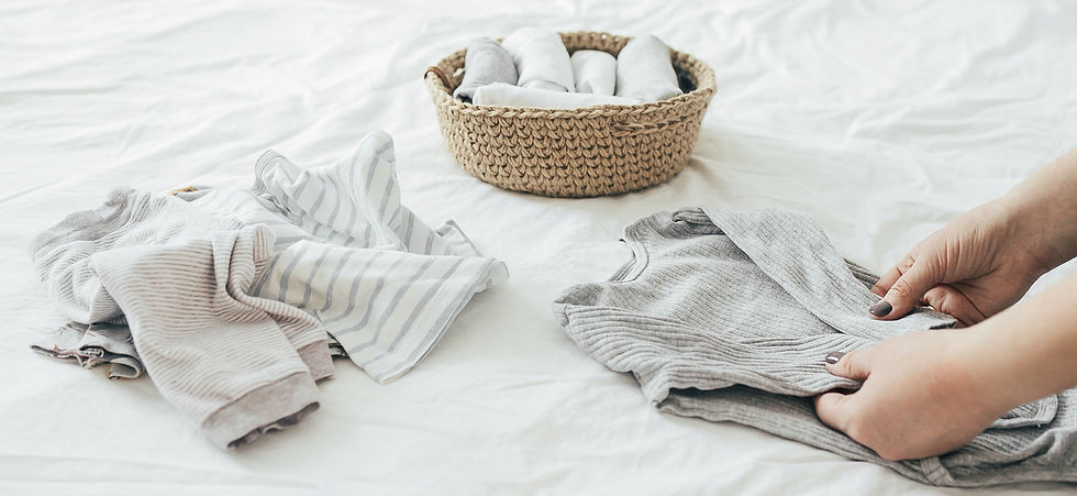 Neatly folded clothes in a modern basket.