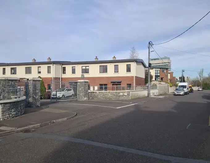 Another area of the Downview Complex in which Apartment 7, currently available for sale, is located; this area features townhomes.