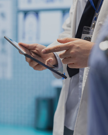 physician-consulting-with-his-staff-to-a