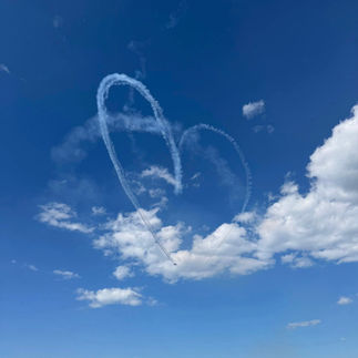 The Jetstream from the plane in the first photo made a 'heart' shape in the sky.
