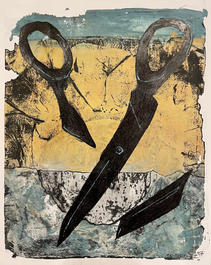 broken scissors on top of a sheet of paper on top of a rock