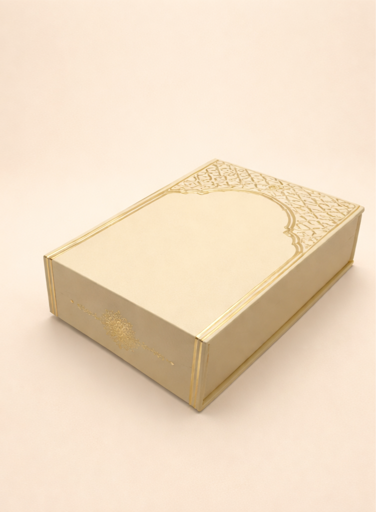 Cream box with ornate golden arch design on lid
