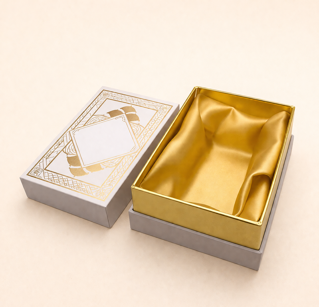 Open gift box with gold satin lining and decorative lid