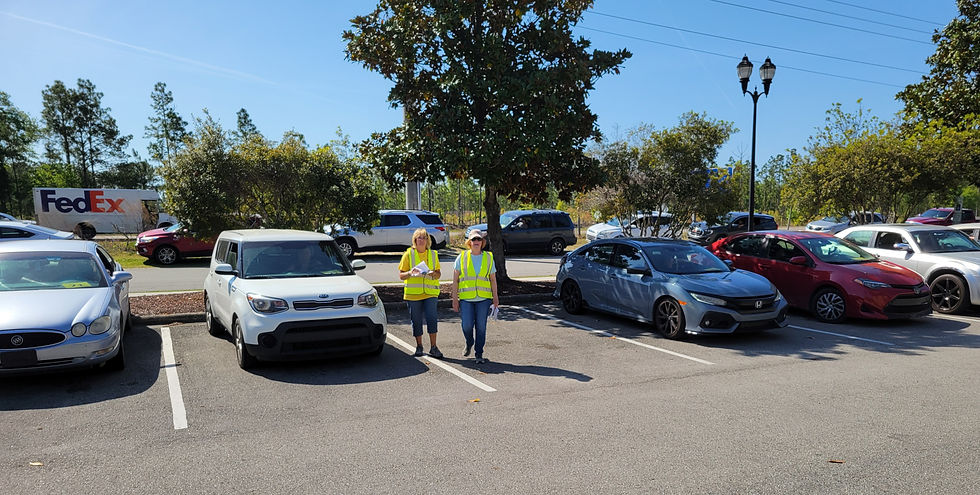 Cars in the parking lot awaiting their turn to pick up food