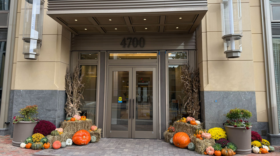 Fall entrance display at Hampden House Apartments in Bethesda MD