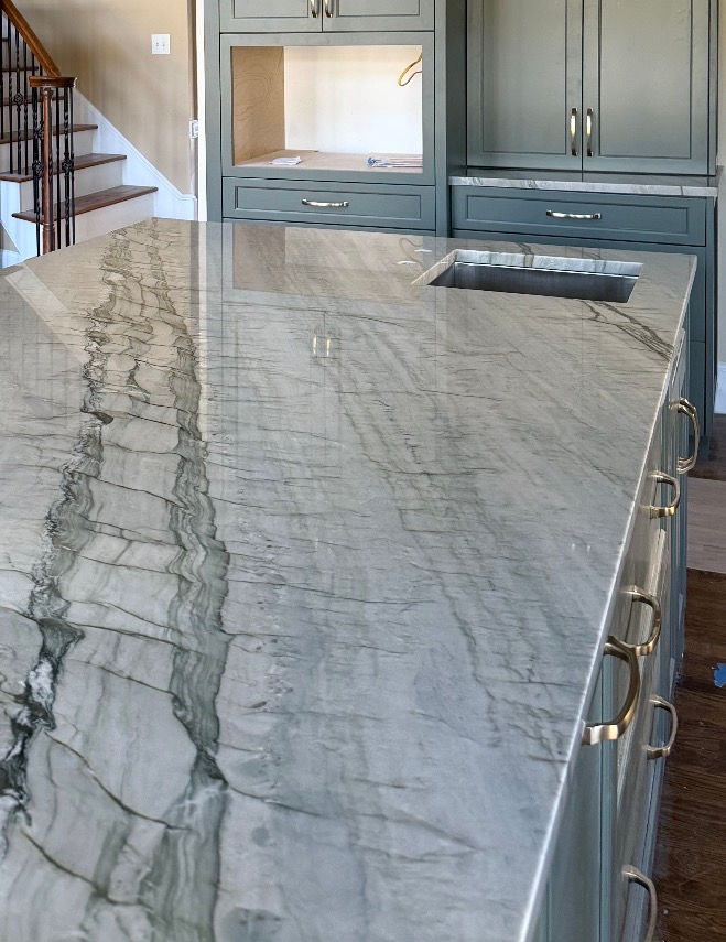 Kitchen remodel in Huntersbille with Brazilian Audacia quartz countertops and green custom cabinets. Built by contractor Turner Design Build.