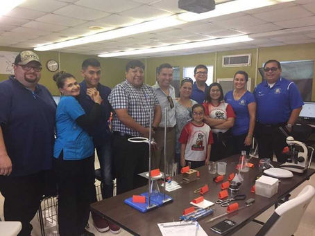 Fall Open House - Parents visiting with Mr. Perez to see what is happening in the science lab.