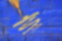 Blue brick wall with white and green spray paint_edited.jpg