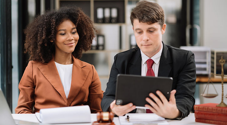 Tax relief advisor reviewing documents with a client to resolve IRS debt and stop garnishment.